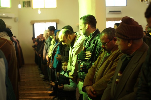 Syrian refugees at Friday Prayers at the Wadi Khaled Mosque on t