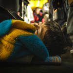 Syrian boy asleep on a bus in Serbia